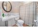 Bathroom features a pedestal sink, decorative mirror, and shower with curtain at 346 Almora Loop, Mooresville, NC 28115