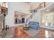 Cozy living room with staircase and view into kitchen at 346 Almora Loop, Mooresville, NC 28115