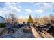 Stone patio with a built-in fire pit surrounded by seating at 346 Almora Loop, Mooresville, NC 28115