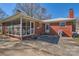 Charming brick home with screened-in porch, patio and well maintained yard at 4017 Leeds Dr, Charlotte, NC 28205