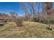 Expansive backyard featuring mature trees and potential for landscaping at 4017 Leeds Dr, Charlotte, NC 28205