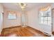 Bright bedroom showcasing hardwood floors, a ceiling fan and an enclosed glass shower at 4017 Leeds Dr, Charlotte, NC 28205