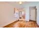 Bedroom featuring hardwood floors, a ceiling fan and access to an adjacent bathroom with pink tile at 4017 Leeds Dr, Charlotte, NC 28205