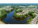 Aerial view of houses surrounding a lake, showing a large community at 41071 Calla Lily St, Fort Mill, SC 29707