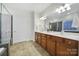 Elegant bathroom with double vanity, large mirror, and shower at 41071 Calla Lily St, Fort Mill, SC 29707