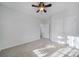 Bright bedroom with ceiling fan and double doors to closet at 41071 Calla Lily St, Fort Mill, SC 29707