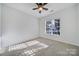 Well-lit bedroom with ceiling fan and carpet flooring at 41071 Calla Lily St, Fort Mill, SC 29707