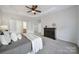 Spacious bedroom with carpet, ceiling fan, and access to bathroom and closet at 41071 Calla Lily St, Fort Mill, SC 29707