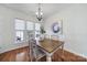 Bright dining room with hardwood floors and large windows at 41071 Calla Lily St, Fort Mill, SC 29707