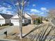 Single-story home with attached garage and neatly landscaped front yard at 41071 Calla Lily St, Fort Mill, SC 29707