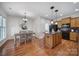 Kitchen with island, hardwood floors, and breakfast nook at 41071 Calla Lily St, Fort Mill, SC 29707