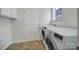 Laundry room with washer, dryer, and cabinets at 41071 Calla Lily St, Fort Mill, SC 29707