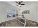 Bright home office featuring a desk and large windows at 41071 Calla Lily St, Fort Mill, SC 29707