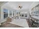 Relaxing sunroom with ample natural light and comfy seating at 41071 Calla Lily St, Fort Mill, SC 29707