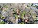 Aerial view of a charming house nestled among mature trees in a quiet residential area, near local amenities at 4321 Gillespie Ct, Charlotte, NC 28205