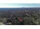 Aerial view of a house with a distant cityscape, showcasing a blend of suburban tranquility and city accessibility at 4321 Gillespie Ct, Charlotte, NC 28205