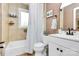 Well-lit bathroom with shower and tub combination, framed mirror, and tiled walls at 4321 Gillespie Ct, Charlotte, NC 28205