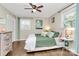 Cozy bedroom with a ceiling fan, closet space, bedside table and natural light at 4321 Gillespie Ct, Charlotte, NC 28205