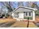 Traditional home with brick accents, offering a classic look with manicured bushes and an inviting front entrance at 4321 Gillespie Ct, Charlotte, NC 28205