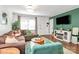 Inviting living room featuring a brown sofa, an area rug, and natural lighting at 4321 Gillespie Ct, Charlotte, NC 28205