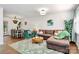 Inviting living room featuring a brown sofa, an area rug, and natural lighting at 4321 Gillespie Ct, Charlotte, NC 28205