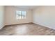 Bright bedroom with hardwood floors and a large window at 4474 Doyle Ridge Rd, Maiden, NC 28650