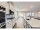 Modern kitchen with white cabinets, quartz countertops and stainless appliances at 4474 Doyle Ridge Rd, Maiden, NC 28650