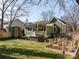 Backyard featuring a lush lawn, storage shed, and gardening boxes at 506 Campus St, Charlotte, NC 28216