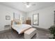 Bright and airy bedroom with large window, a ceiling fan, and wood-look flooring at 506 Campus St, Charlotte, NC 28216