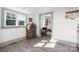 Bright dining room featuring a wooden cabinet stocked with drinks near a window and an arched doorway at 506 Campus St, Charlotte, NC 28216