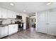 Bright kitchen featuring white cabinets, stainless steel appliances, and dark countertops at 506 Campus St, Charlotte, NC 28216