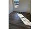 Empty bedroom with luxury vinyl floors, window, fresh paint, and natural light at 523 W Front St, Statesville, NC 28677