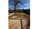 An empty wooden deck with a view of the yard, surrounded by a wooden safety rail at 523 W Front St, Statesville, NC 28677