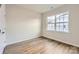 Bright bedroom with hardwood floors and a window with natural light at 5901 Oak Branch Cir, Maiden, NC 28650