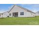 New home exterior with screened porch and grassy backyard at 5901 Oak Branch Cir, Maiden, NC 28650