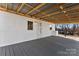 Covered back porch with wood ceiling and flooring at 601 N 12Th St, Bessemer City, NC 28016