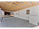 View of the home's back porch, with a gray deck and white walls at 601 N 12Th St, Bessemer City, NC 28016