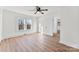 Bright bedroom featuring wood-look floors, neutral walls, and a connecting doorway at 601 N 12Th St, Bessemer City, NC 28016