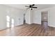 Bedroom with wood-look floors, neutral walls, and two entry doorways at 601 N 12Th St, Bessemer City, NC 28016