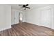 Bright bedroom with hardwood floors, a ceiling fan, and a closet at 601 N 12Th St, Bessemer City, NC 28016