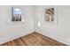 Bright bedroom with two windows providing natural light and vinyl floors at 601 N 12Th St, Bessemer City, NC 28016