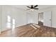 Well-lit bedroom with spacious closet, wood-look flooring, and neutral color palette at 601 N 12Th St, Bessemer City, NC 28016