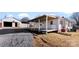 Wide exterior view of the home and outbuilding on the property at 601 N 12Th St, Bessemer City, NC 28016