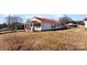 Charming single-Gathering home with a welcoming porch and red metal roof at 601 N 12Th St, Bessemer City, NC 28016