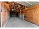 View of the garage interior with unfinished wood walls and concrete floor at 601 N 12Th St, Bessemer City, NC 28016