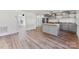 Open concept kitchen with stainless steel appliances and hardwood floors at 601 N 12Th St, Bessemer City, NC 28016