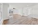 Bright living room features new floors, fresh white paint, and ample natural light at 601 N 12Th St, Bessemer City, NC 28016