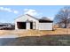 Exterior view of the detached two-bay garage outbuilding with attached storage at 601 N 12Th St, Bessemer City, NC 28016