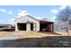 Exterior view of the detached two-bay garage outbuilding with attached storage at 601 N 12Th St, Bessemer City, NC 28016