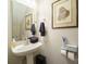 Small bathroom with pedestal sink at 6238 Mountain Vine Ave, Kannapolis, NC 28081